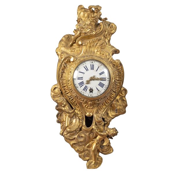 Gille Lainé,  orologio cartel in bronzo dorato e cesellato
