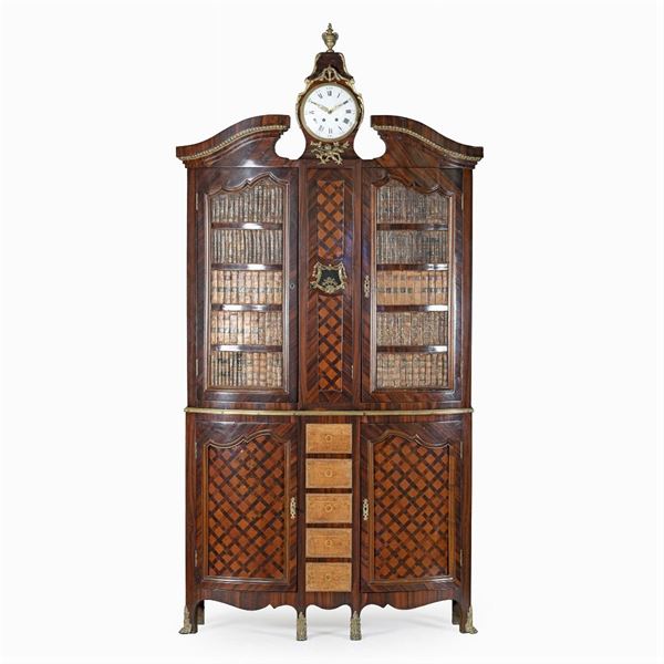 Trumeau orologio in legni vari con montature in bronzo dorato
