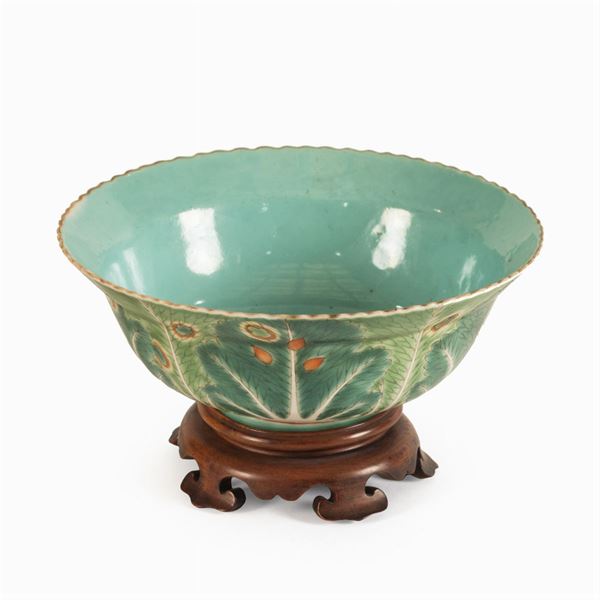 Small porcelain cup with a turquoise background