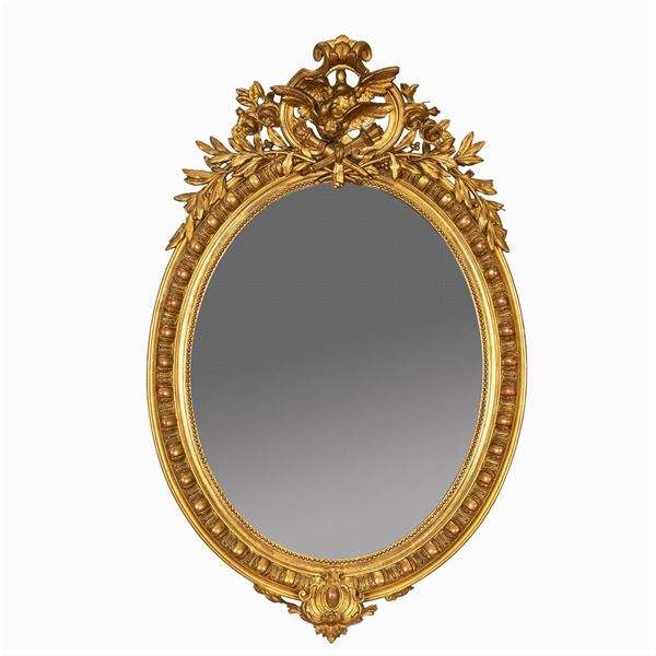 Oval wood and gilded pastiglia mirror