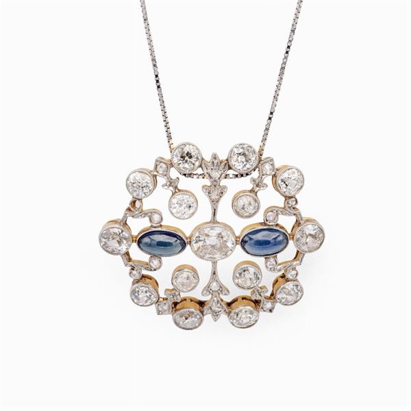 Antique pendant in platinum and 14kt yellow gold with diamonds and sapphires