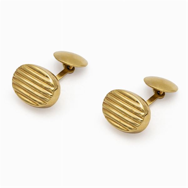 Oval 18kt yellow striped gold cufflinks