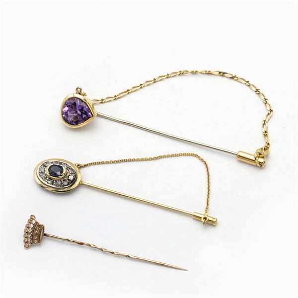 Three 18kt rose and yellow gold pins