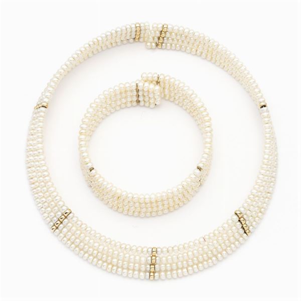 Choker e bracciale a manetta a quattro fili di perle