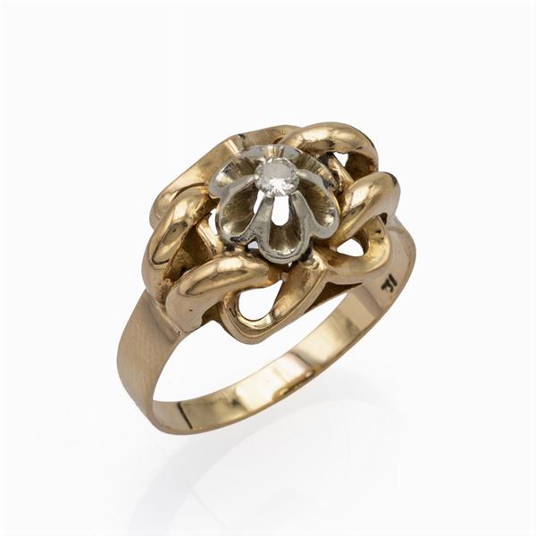 Anello in oro giallo e bianco 18kt con un diamante