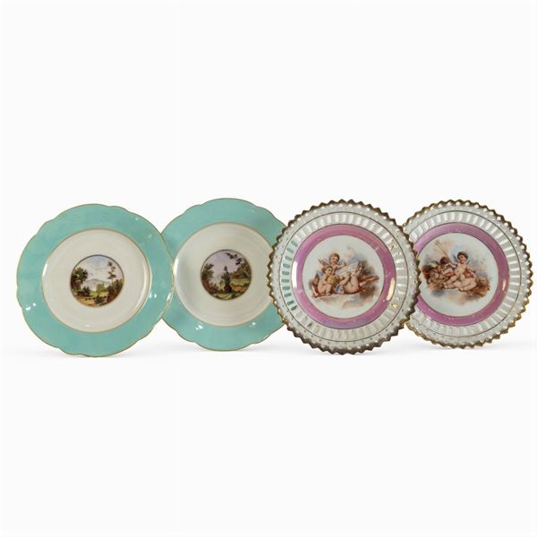 Group of four plates in polychrome porcelain
