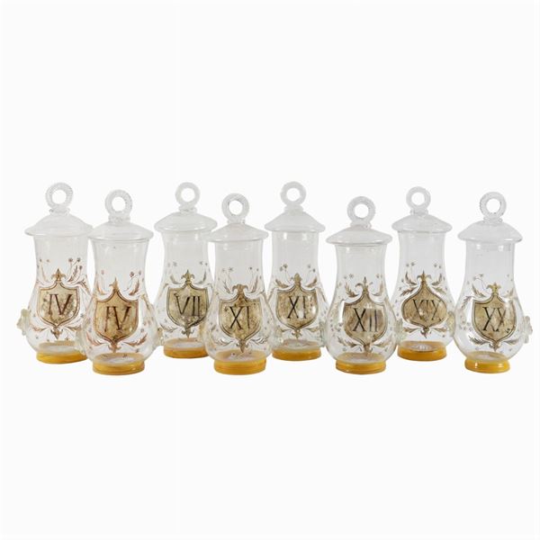 Eight blown glass vases with lids