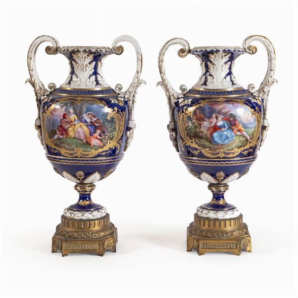 Pair of vases in polychrome porcelain and gilt bronze