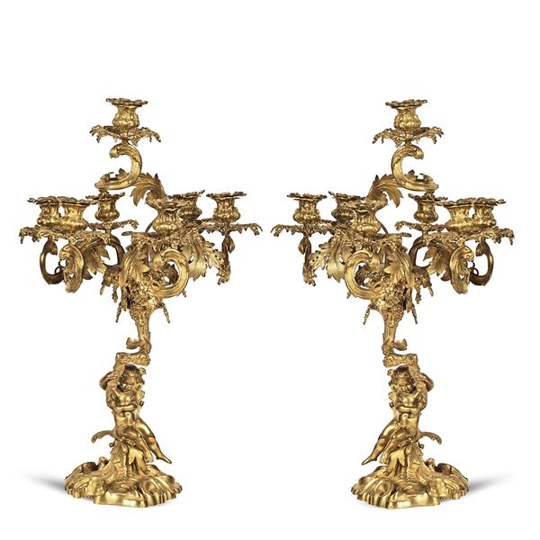 Coppia di candelabri a sette luci in bronzo dorato