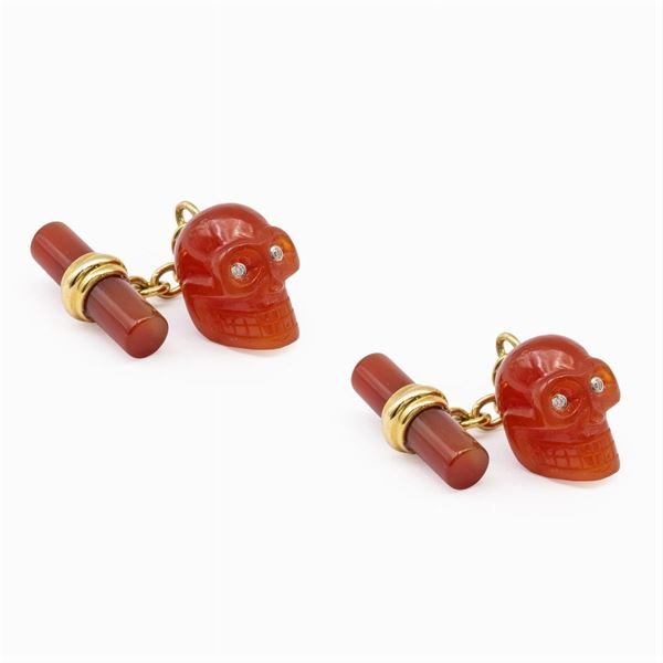 Gemelli teschio in oro giallo 18kt