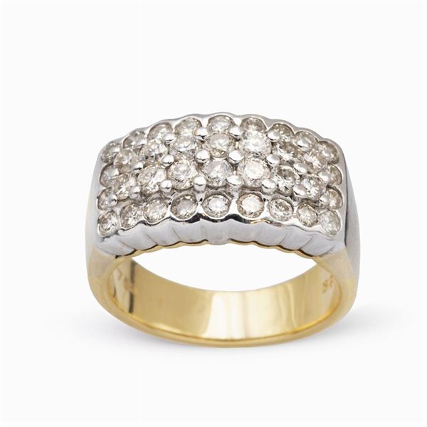 Anello a fascia in oro bianco e giallo 18kt e diamanti  - Asta Gioielli Orologi e Fashion Vintage - Colasanti Casa d'Aste