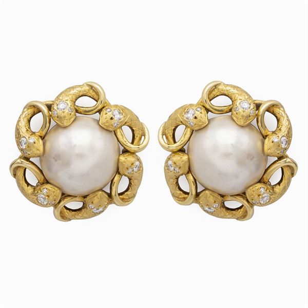Orecchini serpenti a lobo in oro giallo 18kt