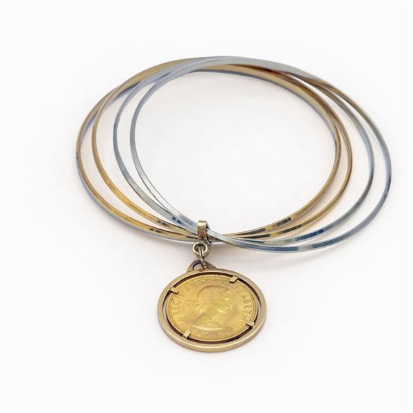 Bracciale manetta a cinque cerchi in oro giallo e bianco 18kt  - Asta Gioielli Orologi e Fashion Vintage - Colasanti Casa d'Aste