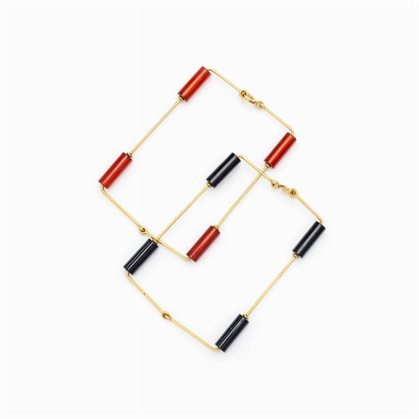 Coppia di bracciali a manetta in oro giallo 18kt