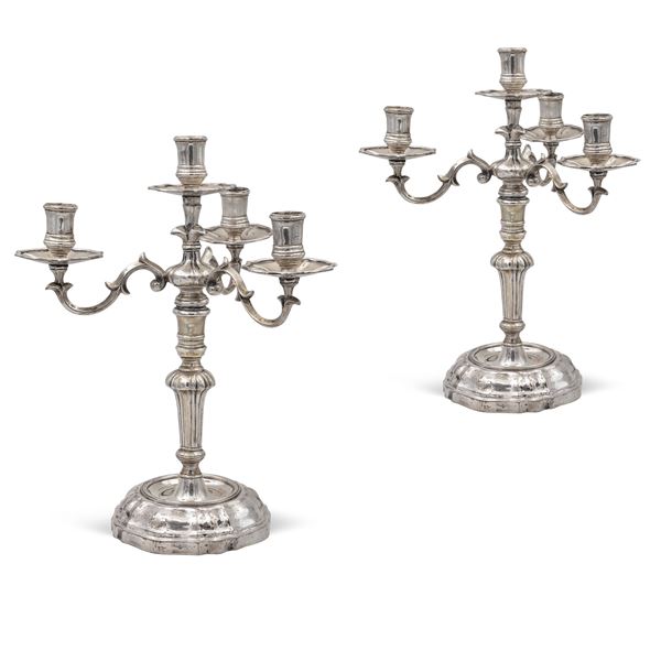 Pair of four-lights silver candelabra