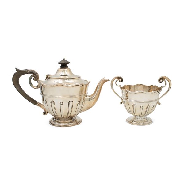 Silver teapot and sugar bowl