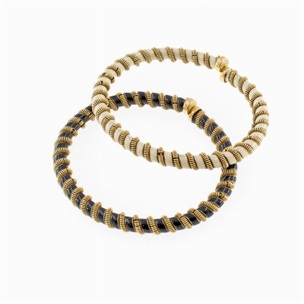 Pair of 18kt yellow gold cuff bracelets