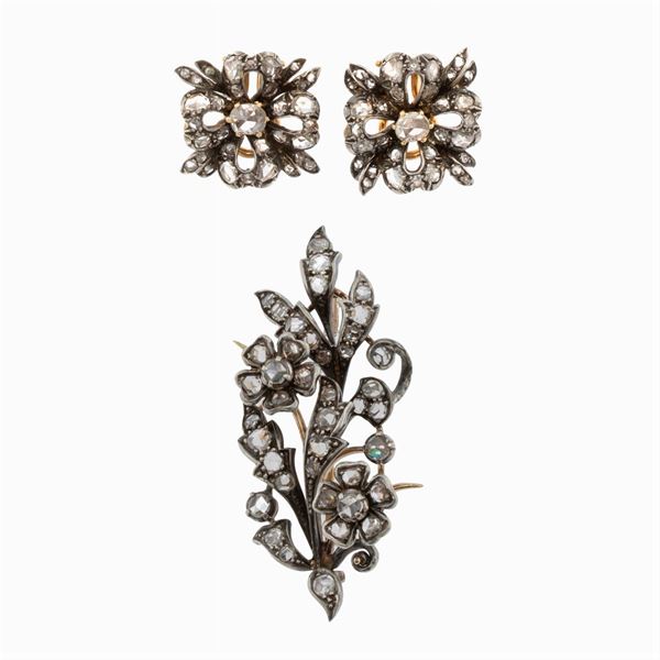 Floral motif set in gold and silver with crowned roses