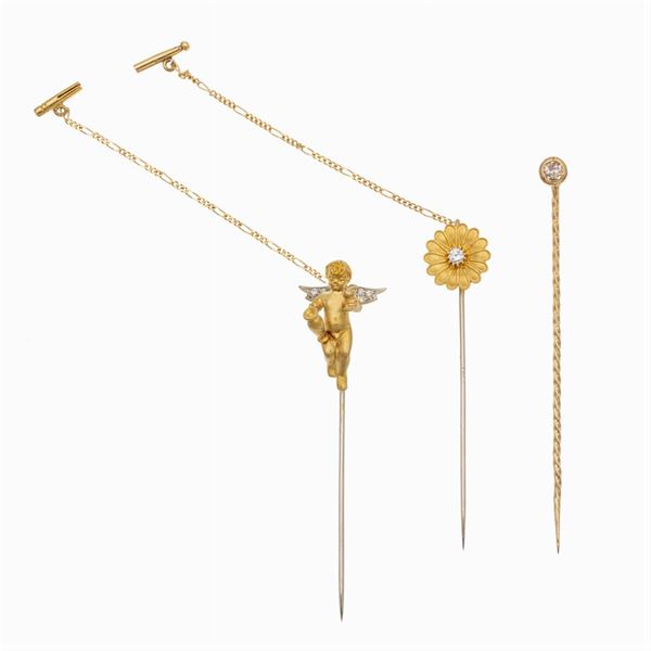 Three 18kt yellow gold pins