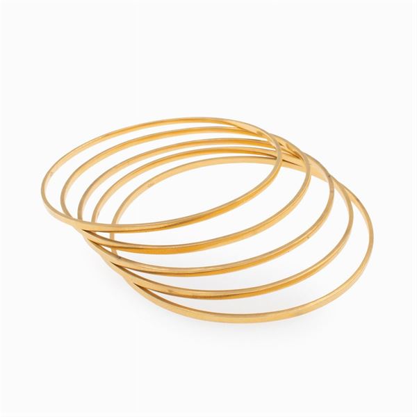 Five 18kt yellow gold cuff bracelets
