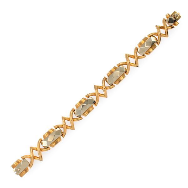 Bracciale a motivo geometrico in oro a due colori 18kt  (anni 40/50)  - Asta Gioielli Orologi | Fashion Vintage - Colasanti Casa d'Aste