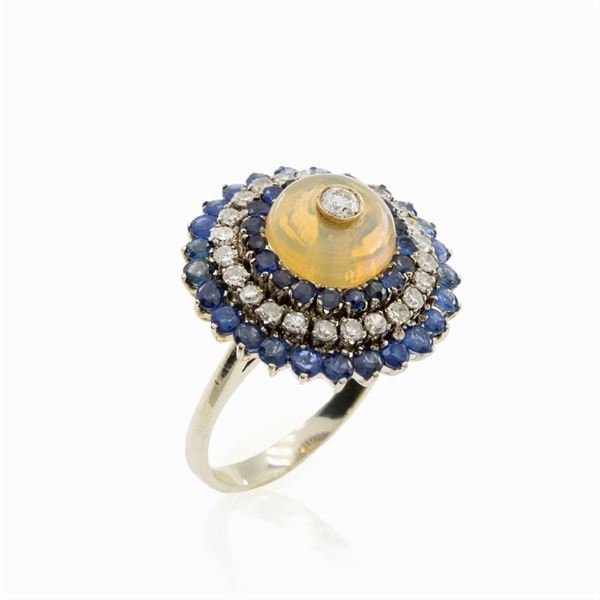 18kt white gold harlequin opal, sapphire and diamond ring