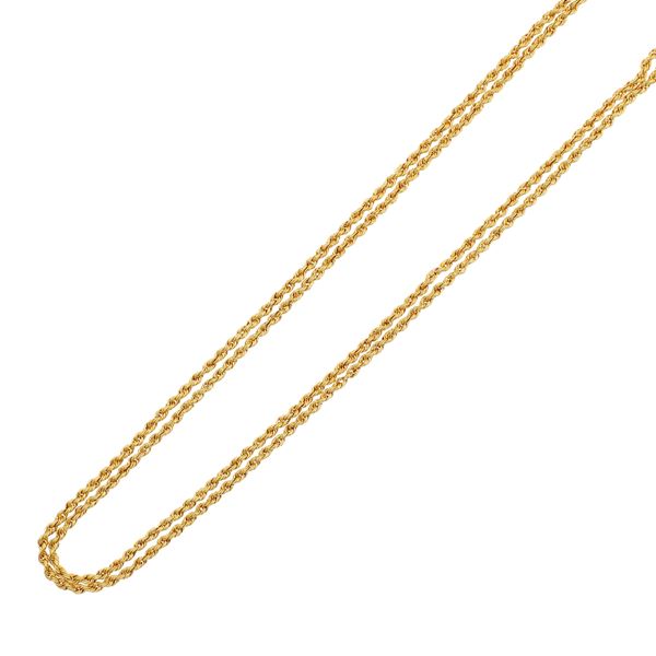Long golden metal necklace