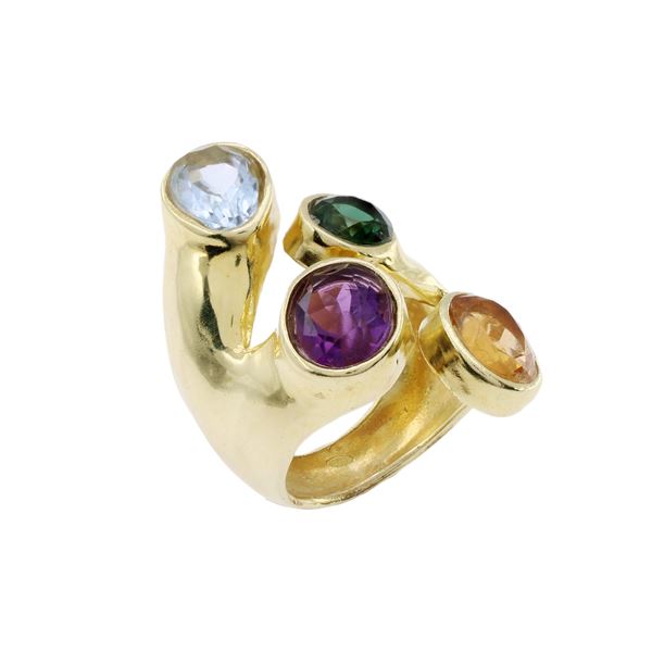 Golden silver ring with four synthetic stones