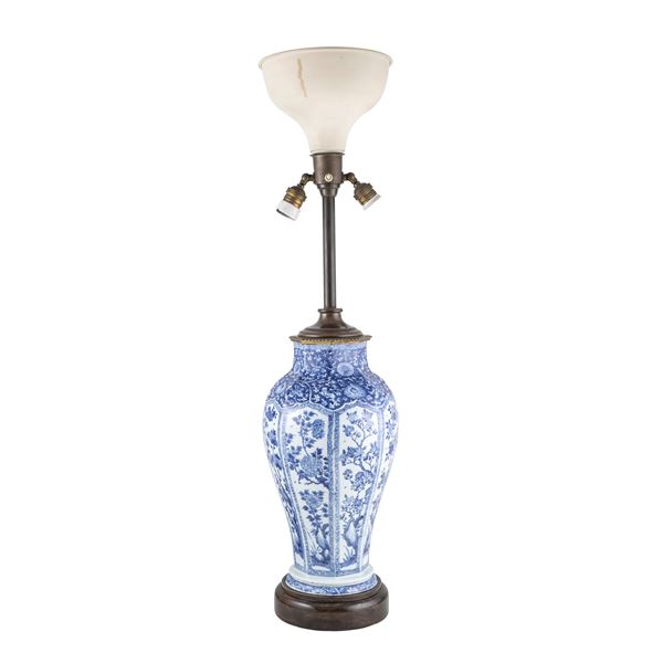 Blue porcelain table lamp on a white background