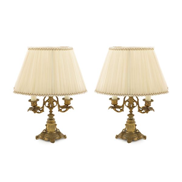 Pair of electrified gilt bronze two-branched candlesticks