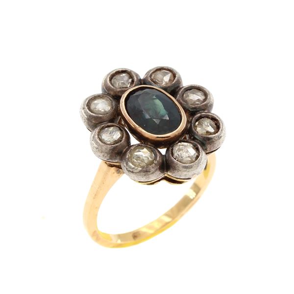 Antique gold and silver ring with oval sapphire and diamond roses