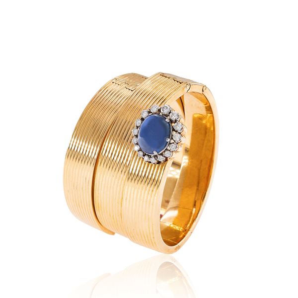 Three 18kt yellow gold with natural sapphire spiral bracelets
