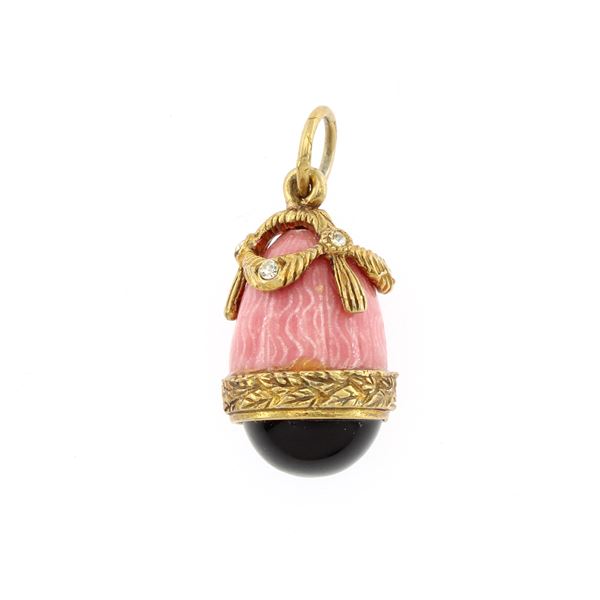 Golden enamel metal and stones egg pendant