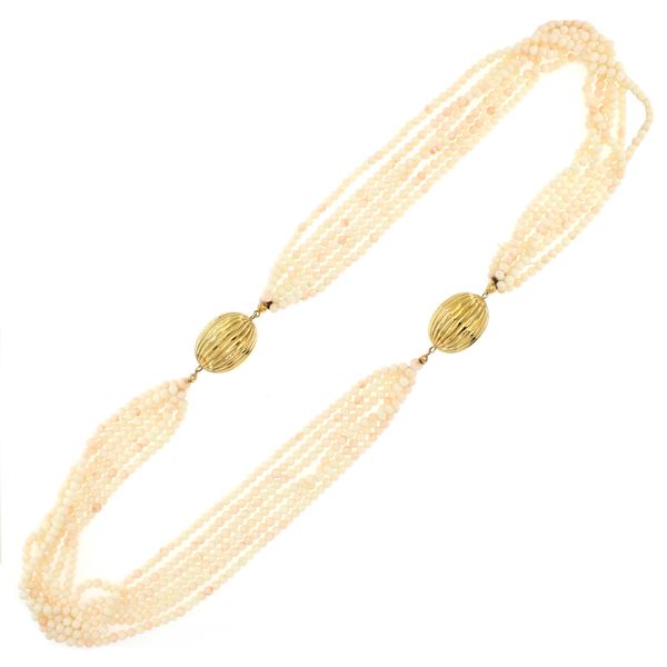 Collana a sei fili di corallo rosa, ai lati due fermezze in oro giallo 18kt