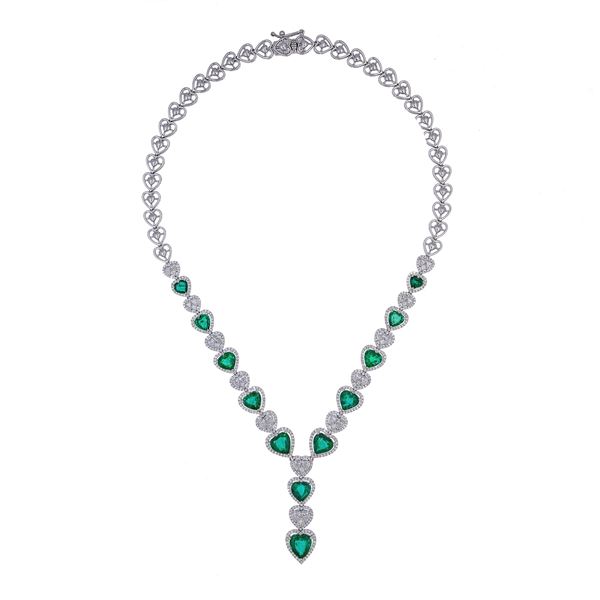 18kt white gold with emeralds and diamonds heart necklace