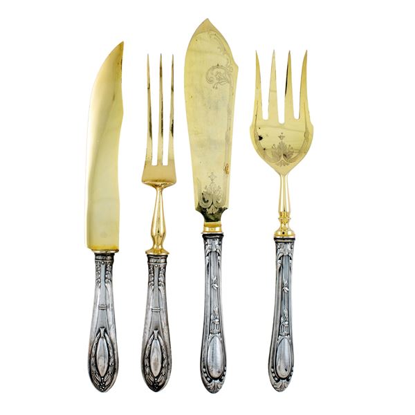 Two sets of serving cutlery with silver handles