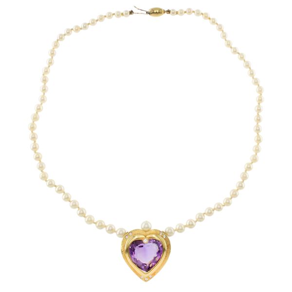 Single strand cultured pearl necklace with heart pendant