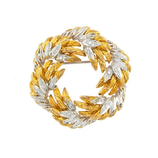 Spilla in oro giallo e bianco 18kt e diamanti
