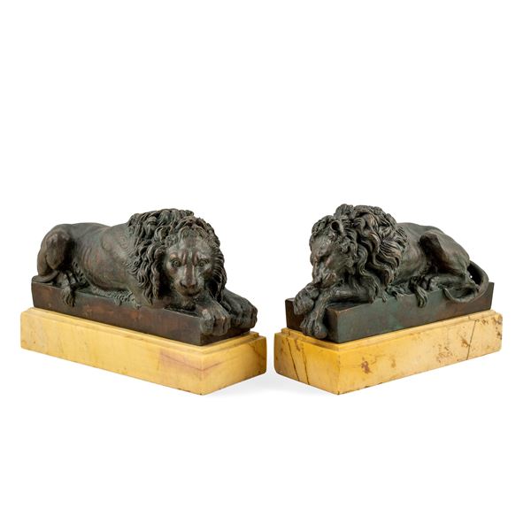 Pair of  patinated bronze and marble sculptures