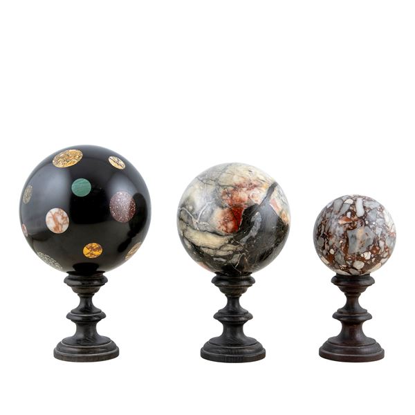 Three polychrome marble spheres