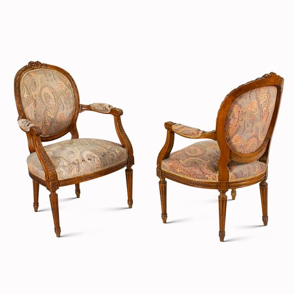 Pair of carved wooden armchairs