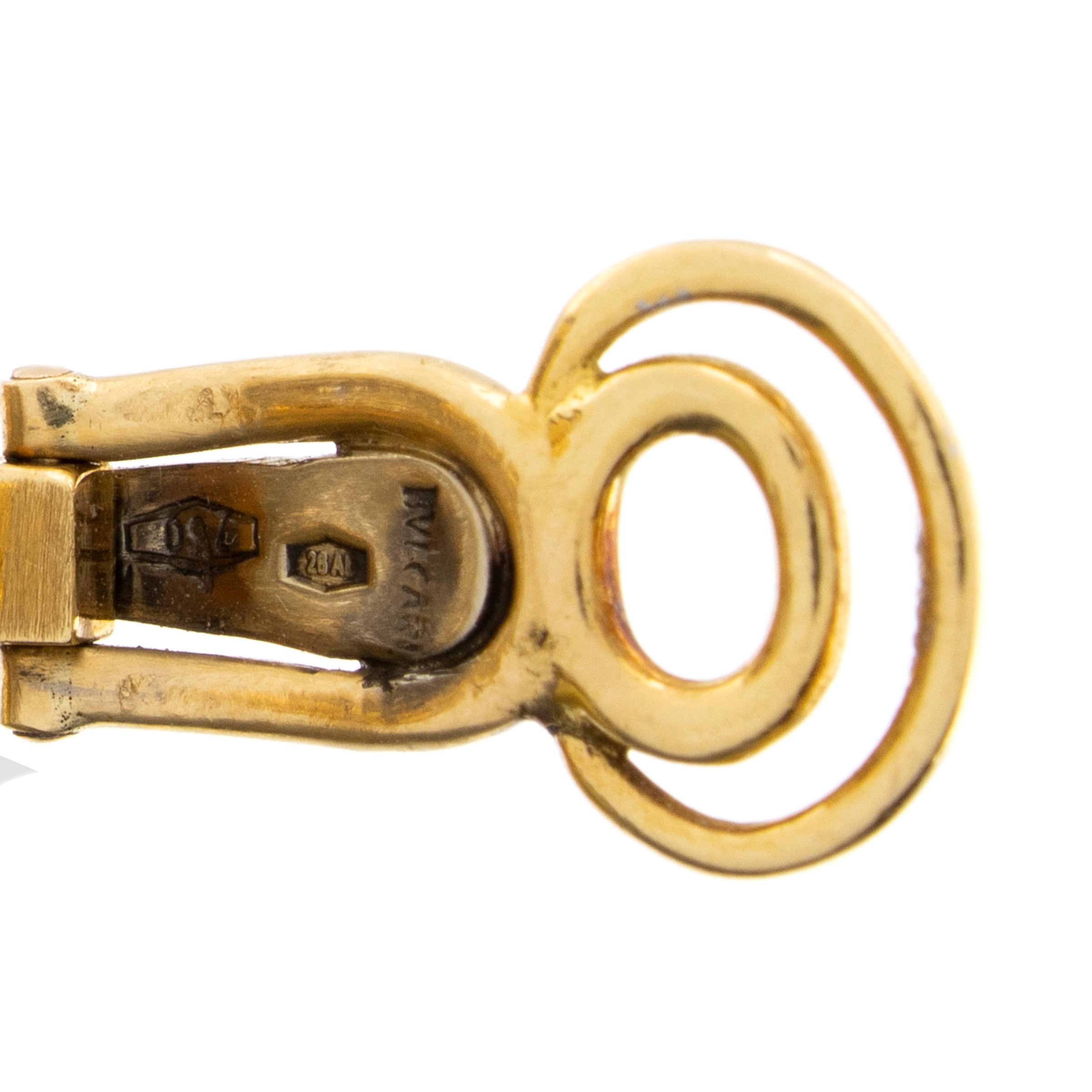 Bulgari spilla e orecchini a lobo en suite