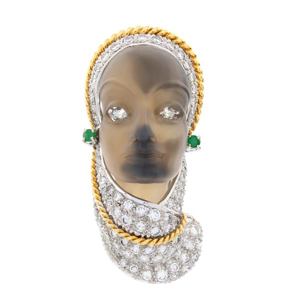 Brooch depicting an oriental female face