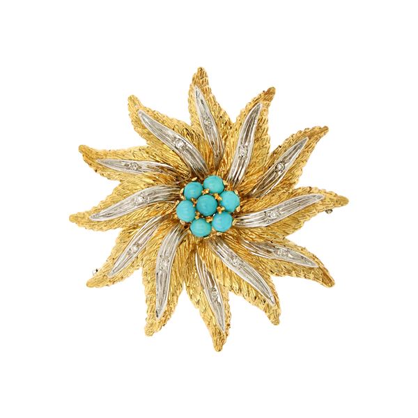 Spilla a motivo floreale in oro a due colori 18kt
