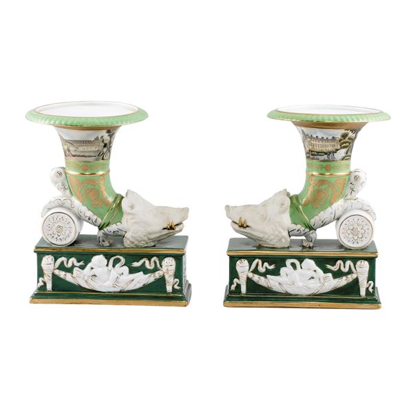 Pair of  in polychrome and partially golden porcelain cornucopia vases