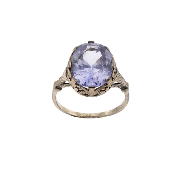 Ancient low gold ring with faceted oval cut sapphire