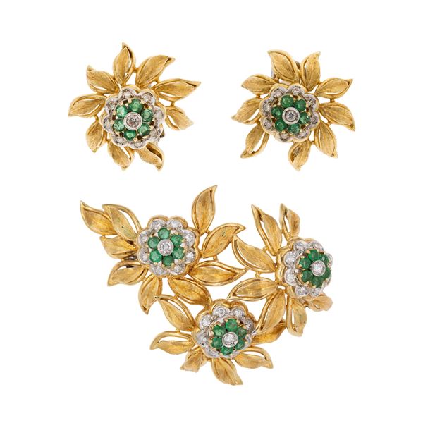Demi parure a motivo floreale in oro giallo e bianco 18kt