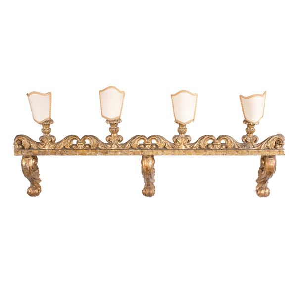 Electrified frieze in golden wood and carved with four lights