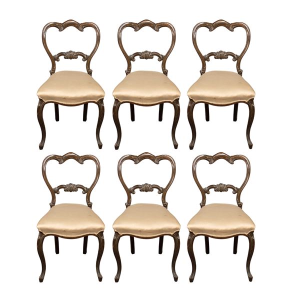 Six carved wooden chairs