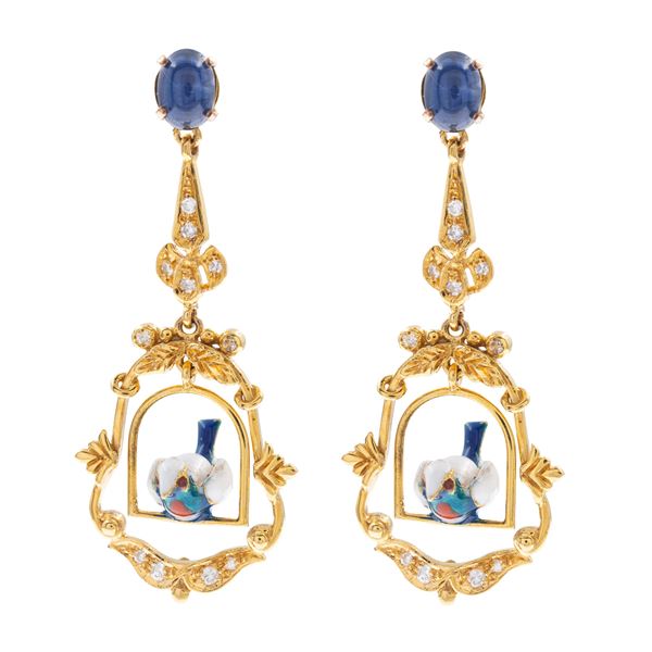 Pendant earrings depicting birds on swing